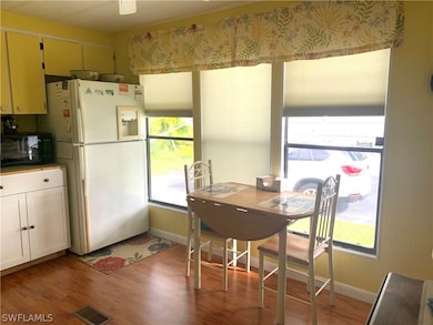 Wood laminate flooring and a nice view from the Kitchen.