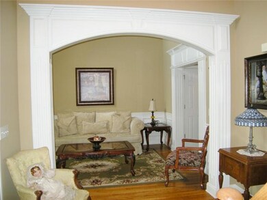 As they enter they will see sparkling wood flooring and elaborate trimmed arched opening.