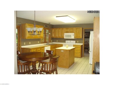 Open kitchen area with ceramic tile floor.  Beauti