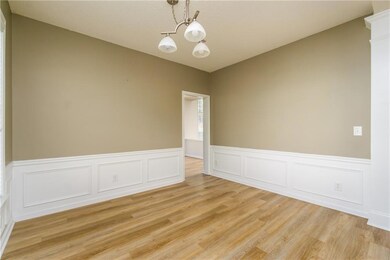 Spare room with light wood-style floors, a chandel