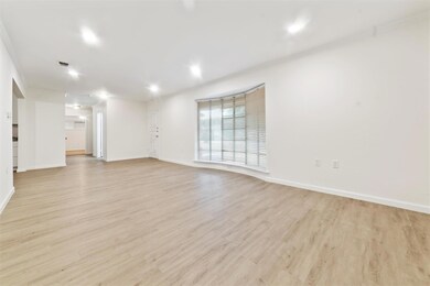 Empty room with light hardwood / wood-style floori