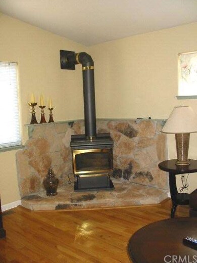 Fireplace on stone hearth in living room