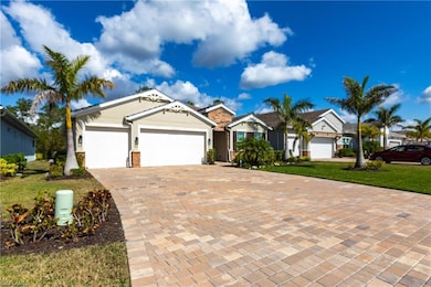 Ranch-style home featuring a garage and a front ya