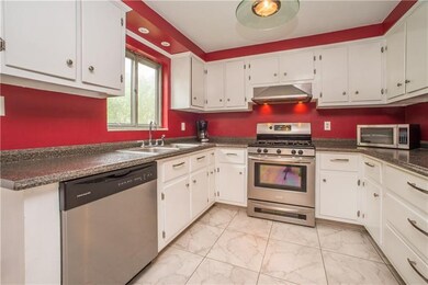 The updated kitchen offers newer countertops, doub