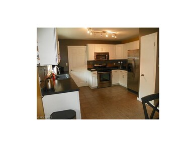 ceramic floored kitchen with stainless steel appli