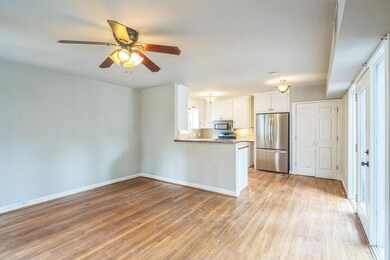 Kitchen with stainless steel appliances, light wo