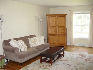Rich, gleaming wood floors can be found throughout