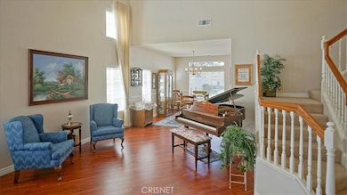 Living room with high ceilings and windows