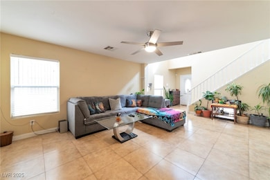 Living area featuring visible vents, a healthy amo