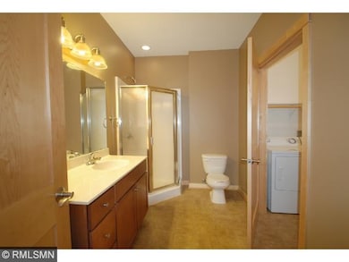 Master bathroom with adjoining laundry area.