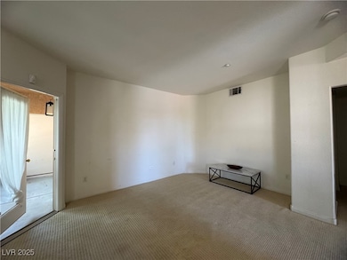 Unfurnished room with light carpet and a smoke det