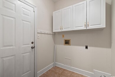 Washroom with hookup for a washing machine, hookup