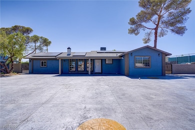 Ranch-style home featuring a chimney and solar pan