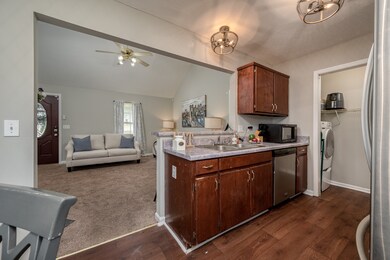 THE KITCHEN IS OPEN TO THE LIVING ROOM ALLOWING YOU TO VISIT WOTH FAMILY AND FRIENDS WHILE YOU COOK.