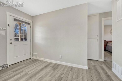 Entryway with light hardwood / wood-style flooring