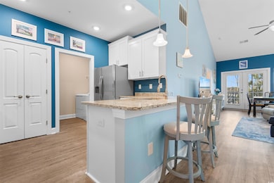 Kitchen featuring decorative light fixtures, white