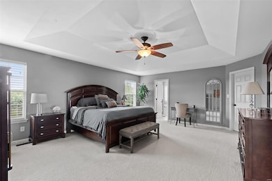 Master Bedroom with Tray Ceiling, walk in closet and en suite bath