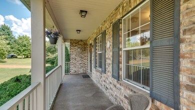 Wrap around front porch perfect for relaxing and catching the sunrises to the east and sunsets in the west. 