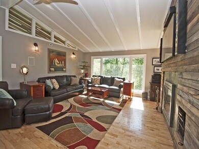 Spacious, bright living room with cathedral ceilin