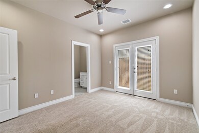 French doors lead outside. All new carpet and all