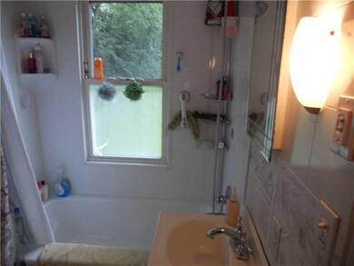 Full Bath. Main bath with newer tub surround.