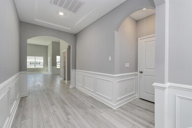 Corridor featuring light wood-type flooring