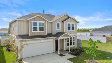View of front of house featuring a shingled roof,
