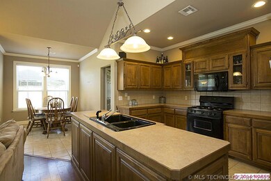 Kitchen opens to nook and great room.
