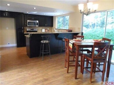 A raised bar topped with NEW granite countertops, 