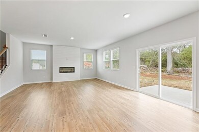 Unfurnished living room featuring light wood-type 