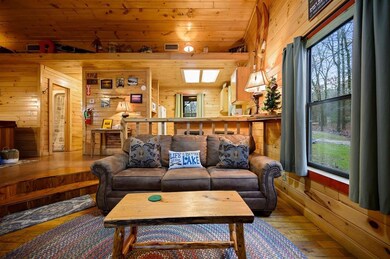 Living room featuring dark hardwood / wood-style f