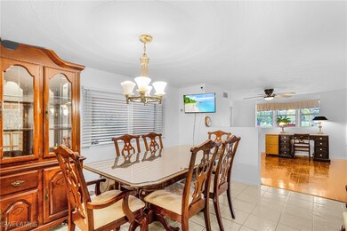 Dining space featuring a chandelier, light tile pa