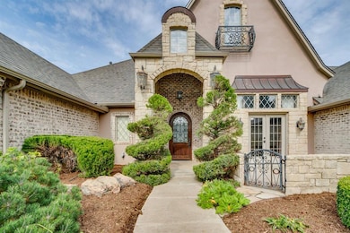 Doorway to property with stone siding, a gate, roof with shingles, a standing seam roof, and a metal roof