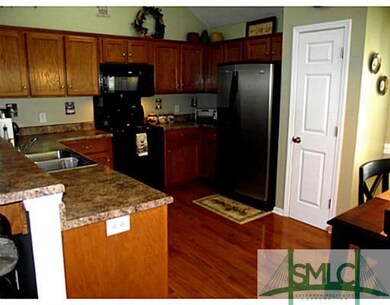 Kitchen. Pretty wood cabinetry, pantry, hardwoods!
