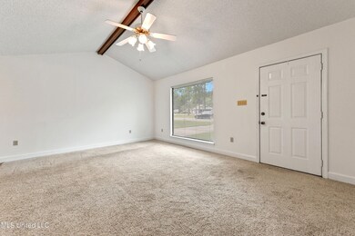 Living Room w/ Vaulted Ceilings.