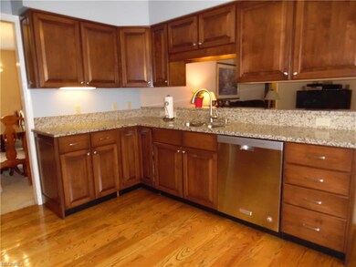 KITCHEN CABINETS AND WOOD FLOOR