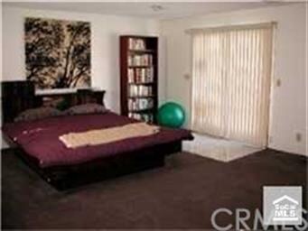 Master bedroom with doors going out to pool area