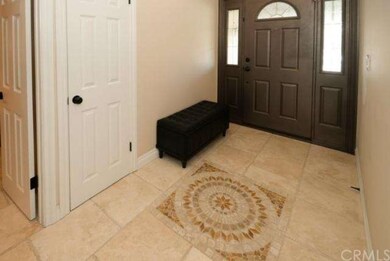 Foyer Area with Designer Travertine. 