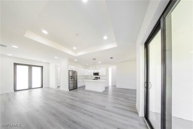 Unfurnished living room with visible vents, basebo