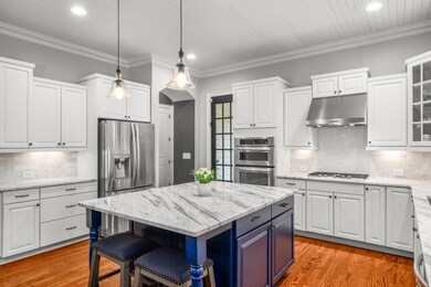 Eat-n island, marble countertops, cabinets galore,