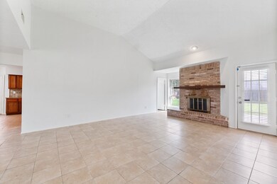 This is a spacious living area with high ceilings,