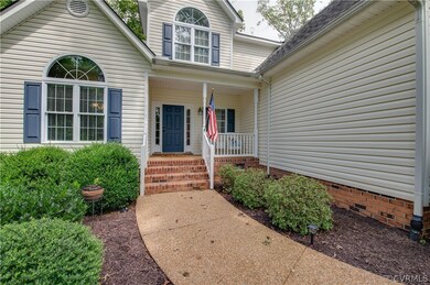 Aggregated walkway with beautiful landscaping welcomes you home.