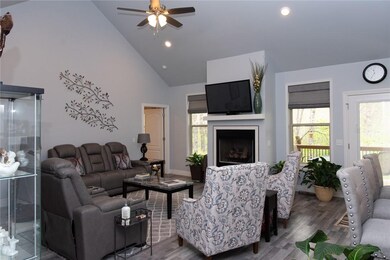 Lots of natural light in the living area.  Custom blinds and gorgeous gas fireplace.