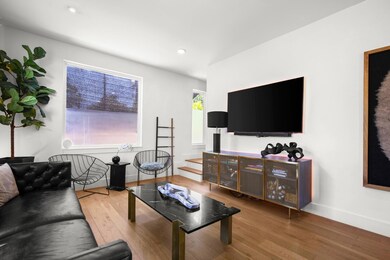 Living room with hardwood / wood-style flooring a