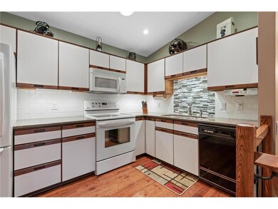 Note the tile backsplash with decorative glass til