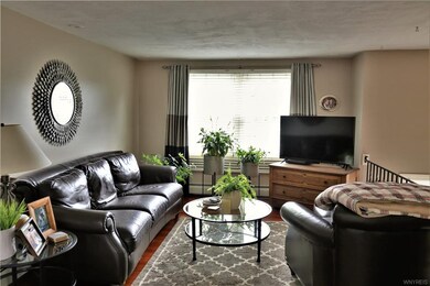 Living room opens to dining room, with updated bam