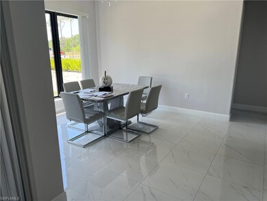 Dining room with marble finish floor and baseboard