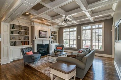 Beautiful rooms with lots of character and charm.  The transom ceiling adds depth while the beautiful windows and mouldings just frame the room so nicely.  Imagine yourself curled up next to the gas fireplace watching it snow!