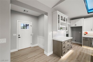Entryway with glass insert cabinets in hutch, 5