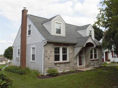 Stone Front Cape Cod with Two Dormers